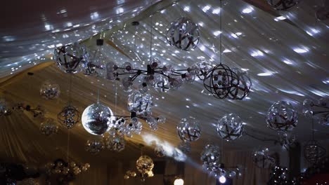shimmering ceiling with many glittering balls. fantastic view of sparkling lights in the restaurant.