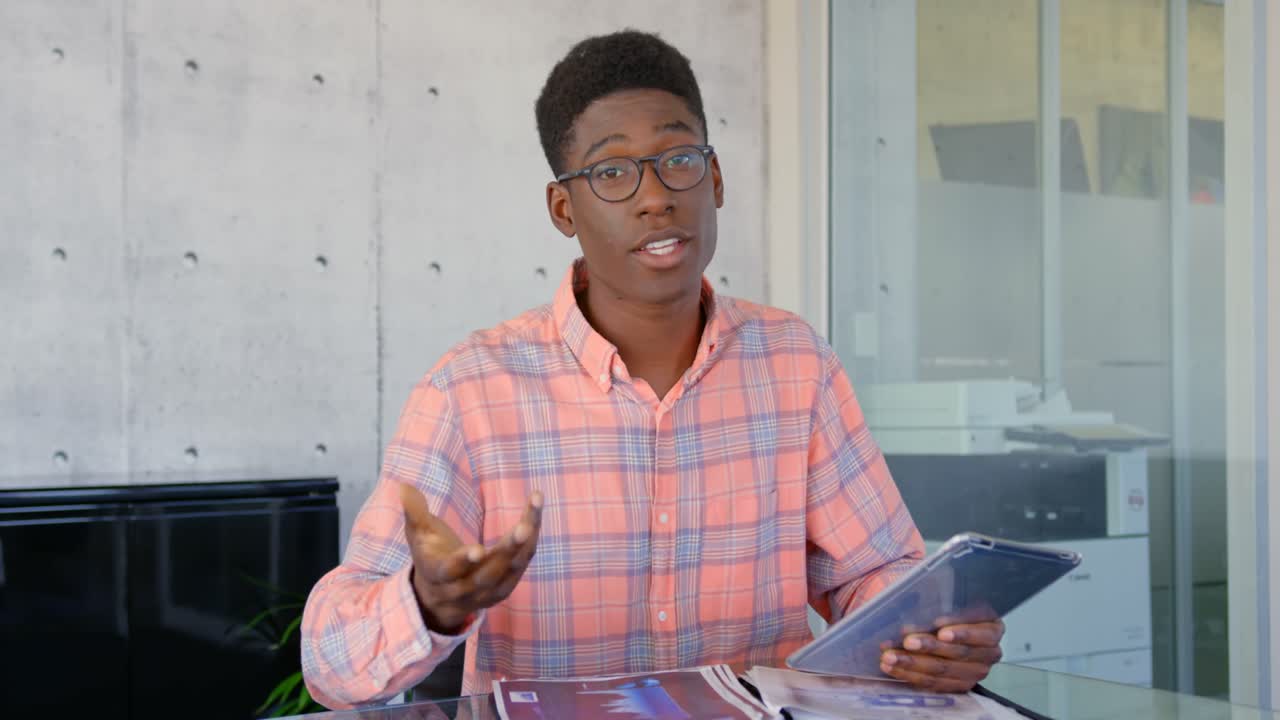 Front view of African American male executive interacting in the office 4k