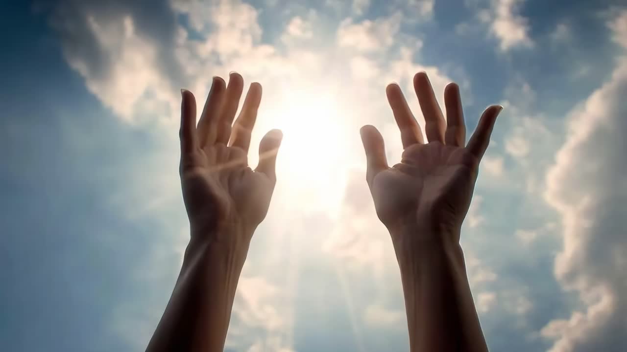 Hands in prayer against a bright sun and cloudy sky, captured from a low angle