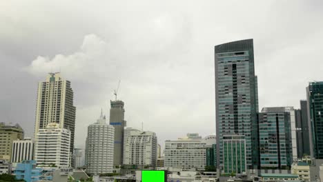 city stormy timelapse with green screen billboard