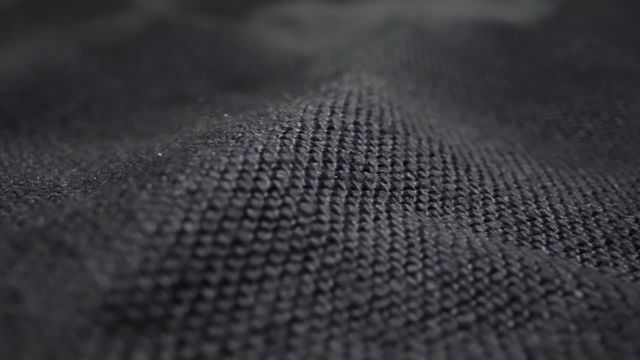 Close-up view of dark fabric texture