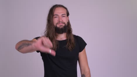 young bearded handsome man with long hair