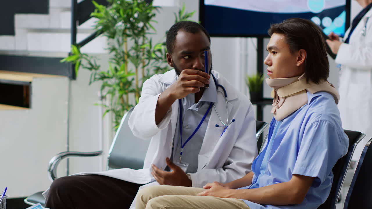 Doctor consulting with patient in hospital waiting room