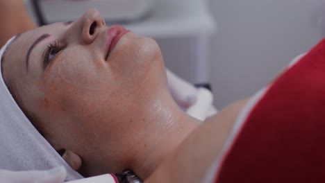 woman receiving facial treatment