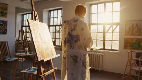 artists painting in a studio