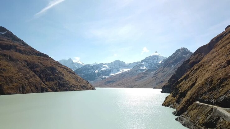 Aerial shot of the Grande Dixence Dam, world highest concrete gravity dam, featuring Lac des Dix and surrounded by snow-capped peaks, part of the Cleuson-Dixence,Valais, Switzerland, Complex