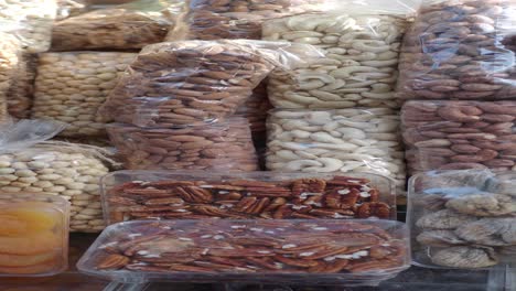 assortment of nuts and dried fruit at a market