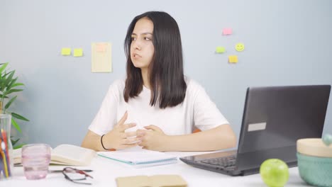 female student annoyed by loud noises.