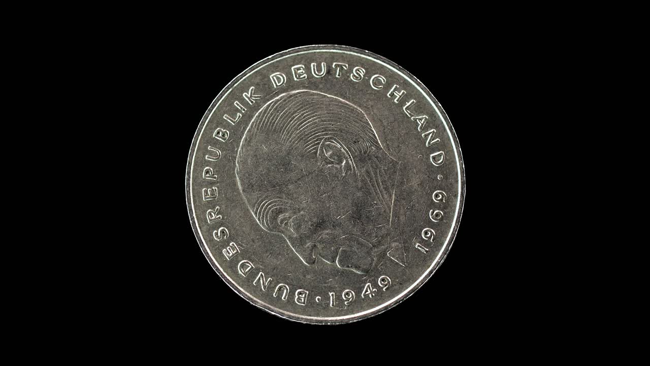 Germany 1977 two deutsche mark coin obverse with portrait of Konrad Adenauer rotating on black background