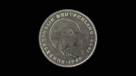 germany 1977 two deutsche mark coin obverse with portrait of konrad adenauer rotating on black background