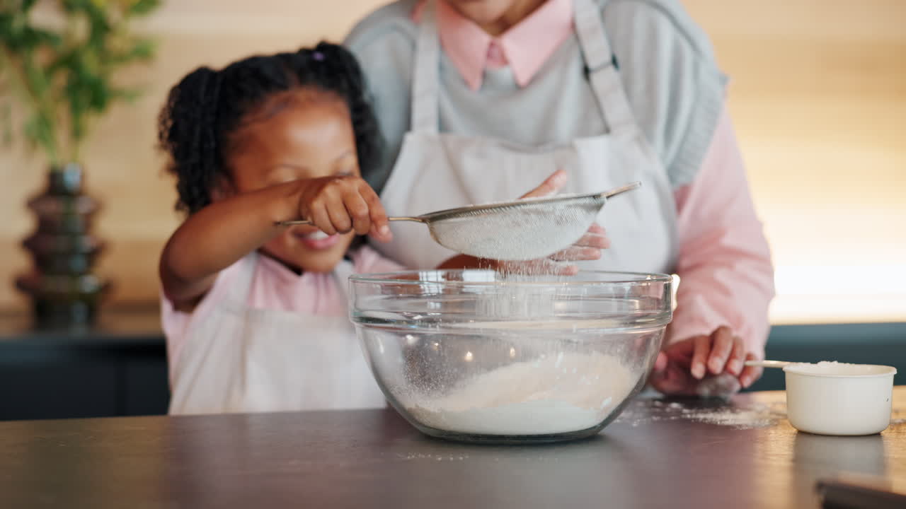Grandmother and granddaughter baking together