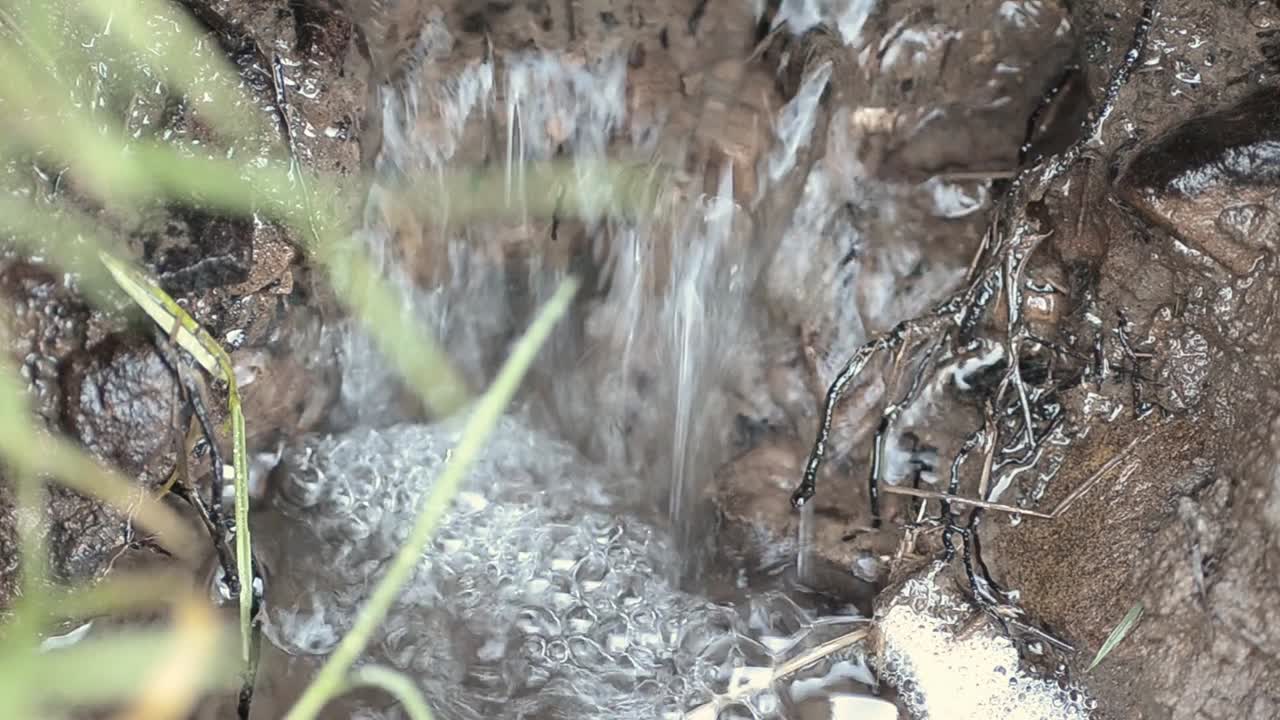 Freshwater stream bubbling closeup