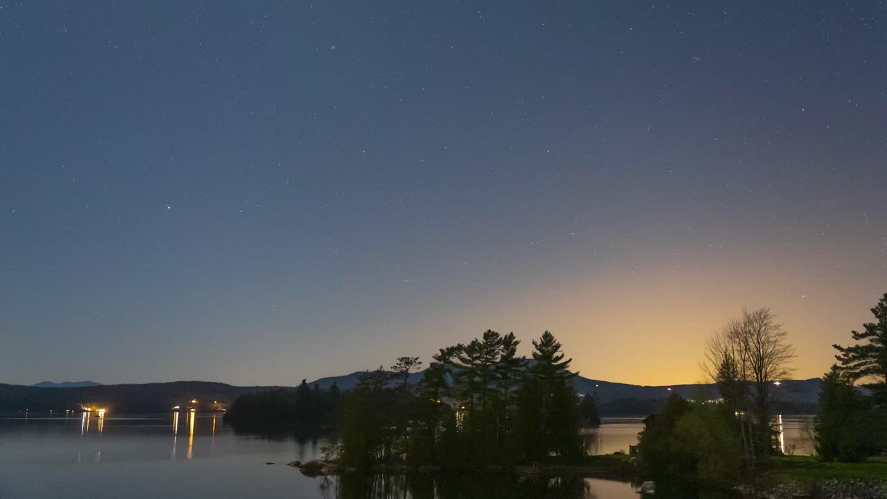 Night time lapse of new England lake with planes and jets flying over 4k 30p