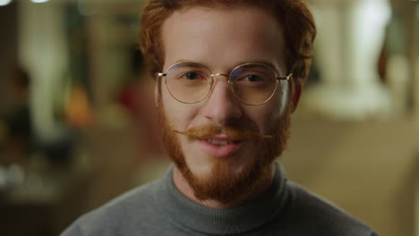 Redhead-businessman-looking-at-camera.-Positive-IT-specialist-smiling-at-camera
