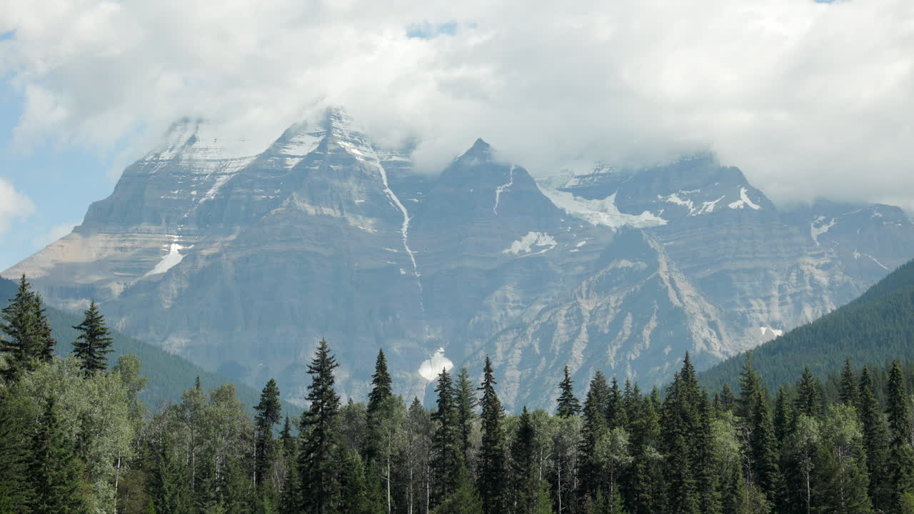 Atmospheric video of Mount Robson’s peak enveloped by clouds in the Canadian Rockies