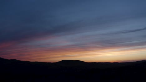 unbelievable colorful sunset in mountain town drone aerial 4k 30p