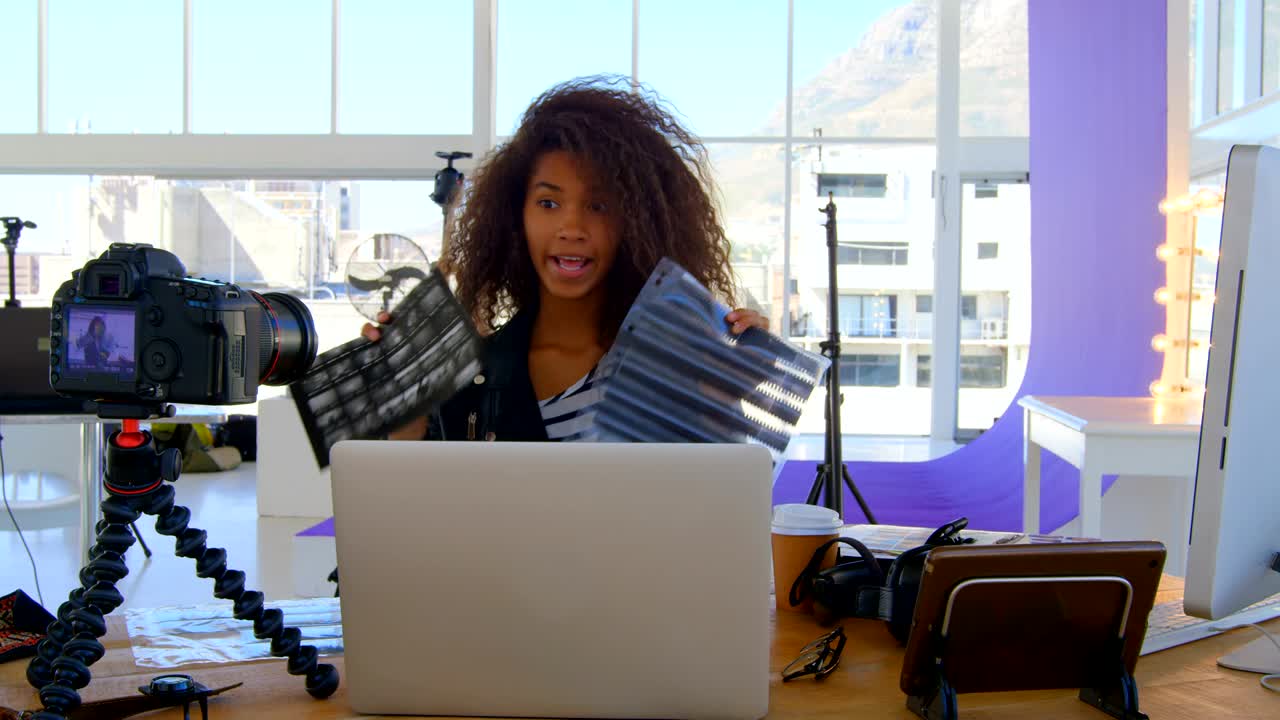 Model recording her video in photo studio 4k