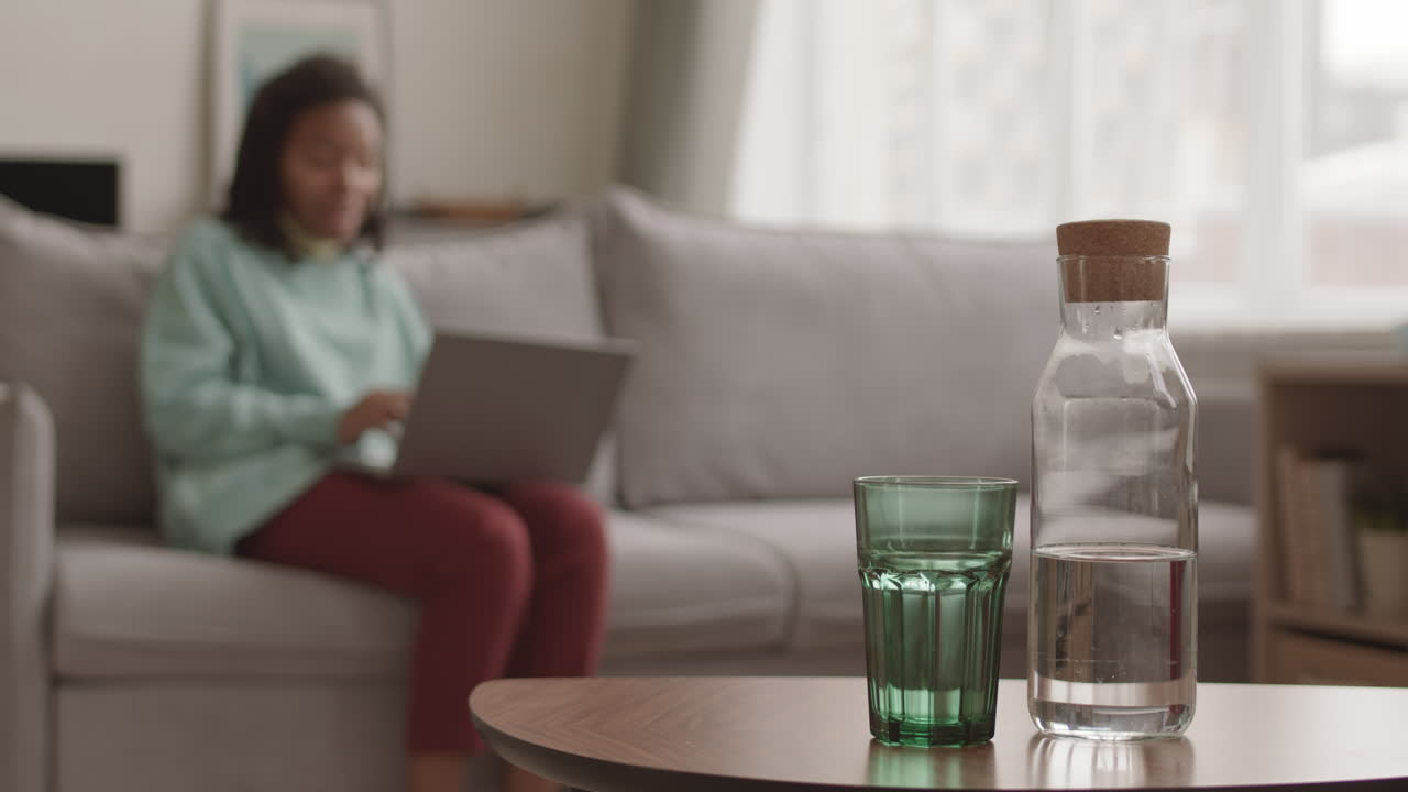 Unrecognizable Woman Having Video Call Using Laptop
