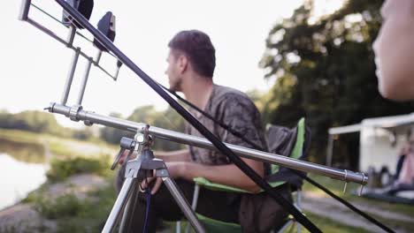handheld video of affectionate father and son during fishing