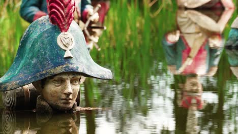 Statue-of-Napoleon-in-deep-water-decaying,-close-up-view