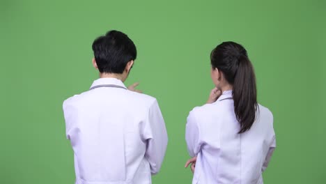 young asian couple doctors together