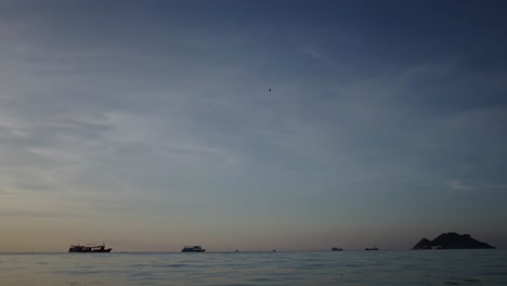 boats on the water at sunset or sunrise