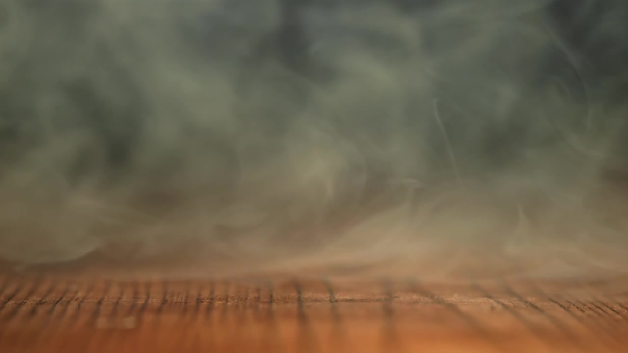 Mysterious White Smoke Flowing Over a Textured Wooden Surface