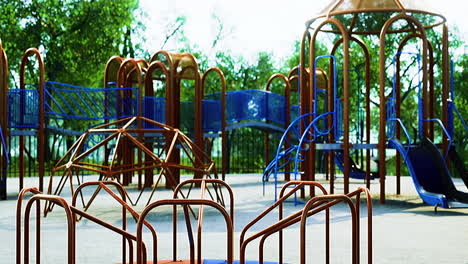 colorful playground structure under the sun surrounded by greenery