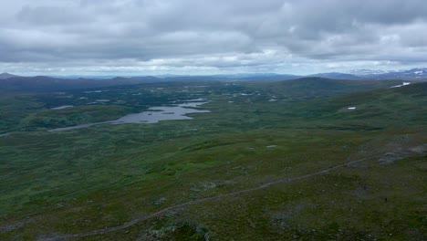 Orbiting-drone-footage-showing-hikers-on-the-top-of-the-Swedish-mountain-’Lill-Skarven