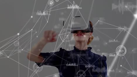 Animation-of-network-of-connections-over-businesswoman-wearing-vr-headsets