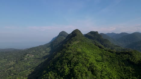 Mexico-Tropical-Mountain-Landscape-Green-Jungle-Hills-sloping-to-fluvial-valley-with-cumulus-clouds-forming-overhead-steady-pace-fast-moving-onshore-breeze-wind-lush