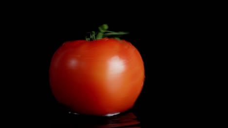 one tomato spinning on the table.