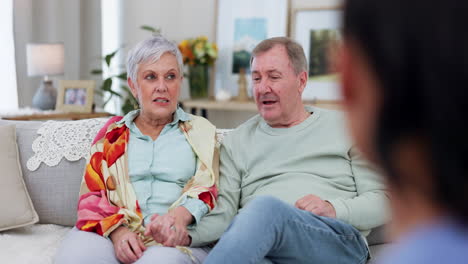 Senior-couple-on-sofa,-therapy-with-psychologist