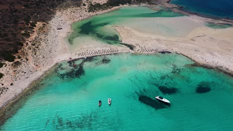 Aerial-wide-view-of-Balos-Beach-and-Lagoon-with-turquoise-water,-mountains-and-cliffs-in-Crete,-Greece