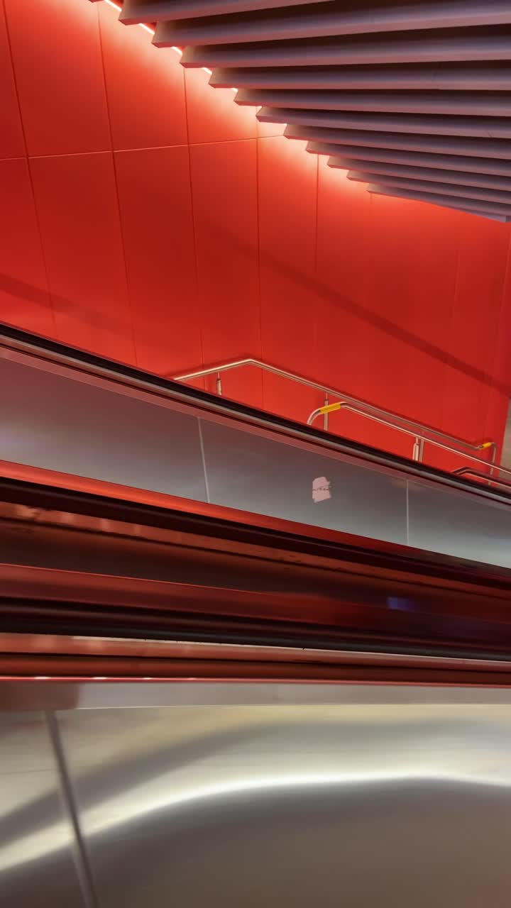 Going down escalator or mechanical staricase in metro station or terminal station. Travel vlog pov point of view of person taking train or subway. UGC style generated content reel for social media