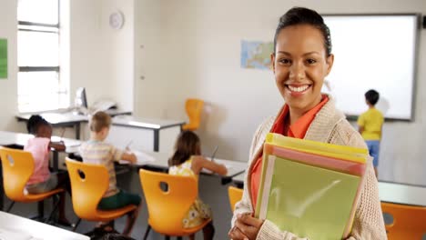 Portrait-of-school-teacher-standing-in-classroom