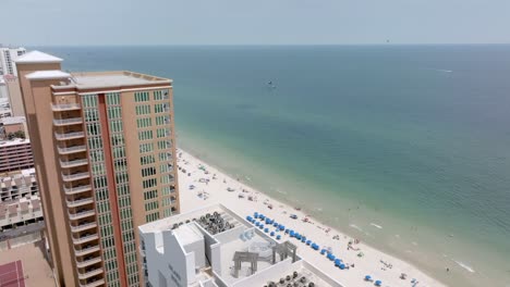 gulf shores, alabama skyline and beach with drone video moving in close to hotel