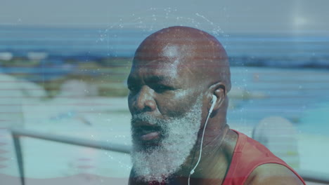 globe of network of connections against african american senior fit man wearing earphones