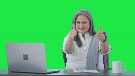 Happy-Indian-senior-businesswoman-showing-thumbs-up-Green-screen