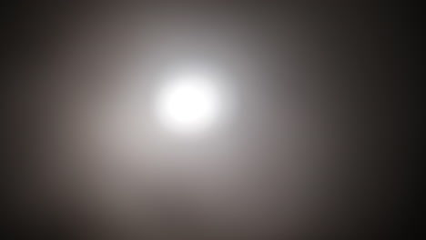 strange, glowing, alien, ufo orb light, ghost or moon light with smoke and fog for halloween or science fiction, sci-fi background