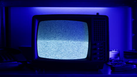 retro tv, vintage television in a nostalgic setup, a retro tv displays grain on screen, scary halloween night device good for chroma key and green screen.