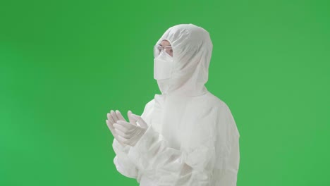 person in protective gear on green screen