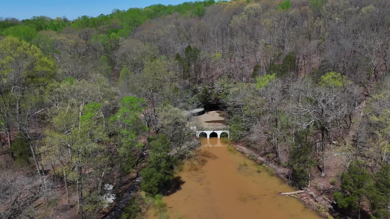 Drone flyaway shot revealing flood damage sustained to both Dunbar Cave State Park, and Swan Lake Golf Course in Clarksville Tennessee