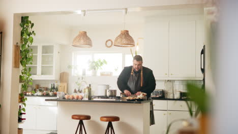 man cooking in a modern kitchen