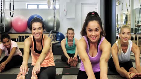 Beautiful-women-exercising-in-fitness-studio