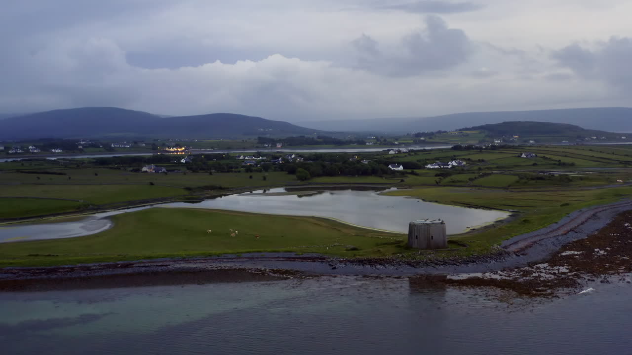 Aerial view of Martello tower from Galway Bay showcasing stunning Irish landscape at twilight