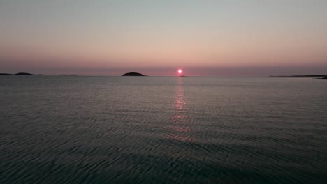 forward moving drone shot of sunset from scottish island