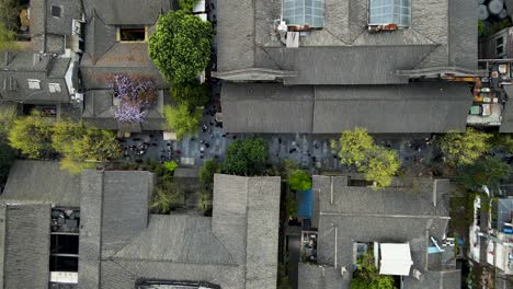 city rooftops and alley streets in chengdu, china - aerial bird's eye view