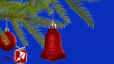 animation of christmas tree decorations over blue background