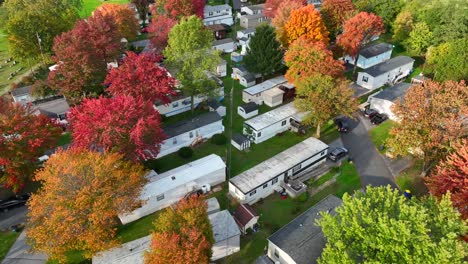 mobile homes in trailer park with colorful trees in autumn